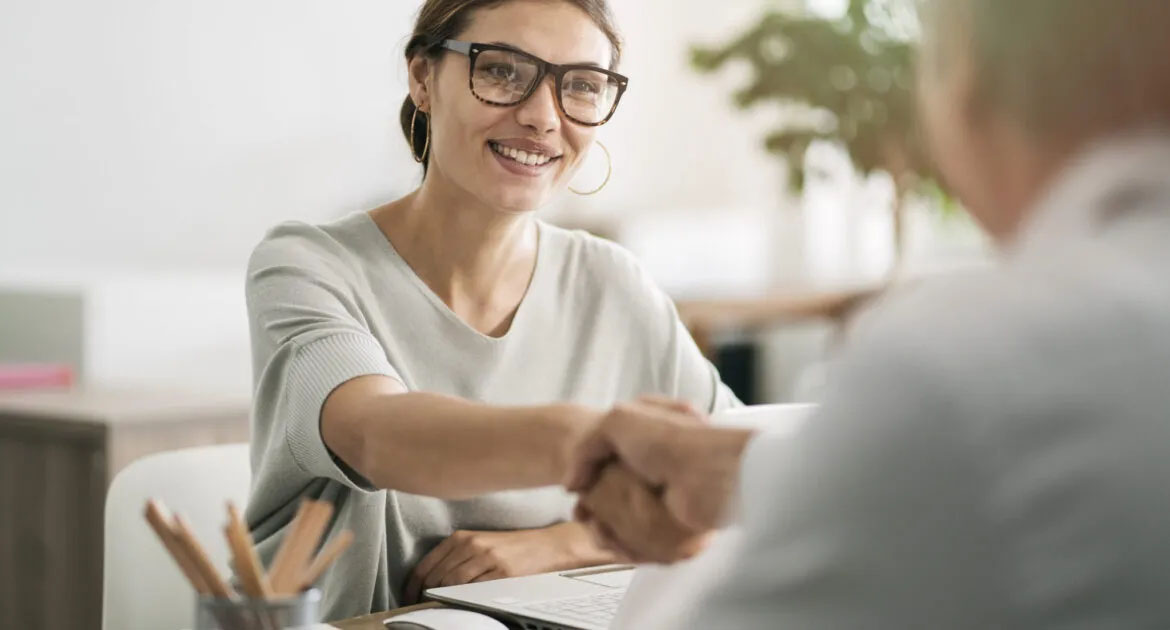 A person shaking hands with another person